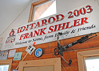 The banner that greeted Frank Sihler as he finished his first race to home hangs in the Sihlers' cabin. Photo copyright 2007 by Leon Unruh.